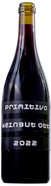 A dark red, round-bodied wine bottle that has thee black banners on it, with a white, typewriter-like font. There`s wine in it and no cork